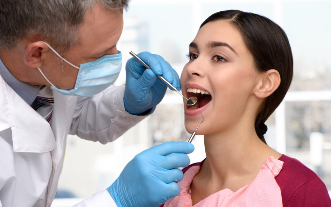 emergency dentist performing oral exam